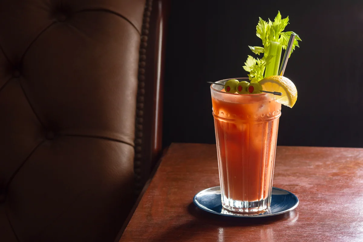 Bloody Mary Cocktail in Glass with Garnish of Olives, Celery, and Lemon