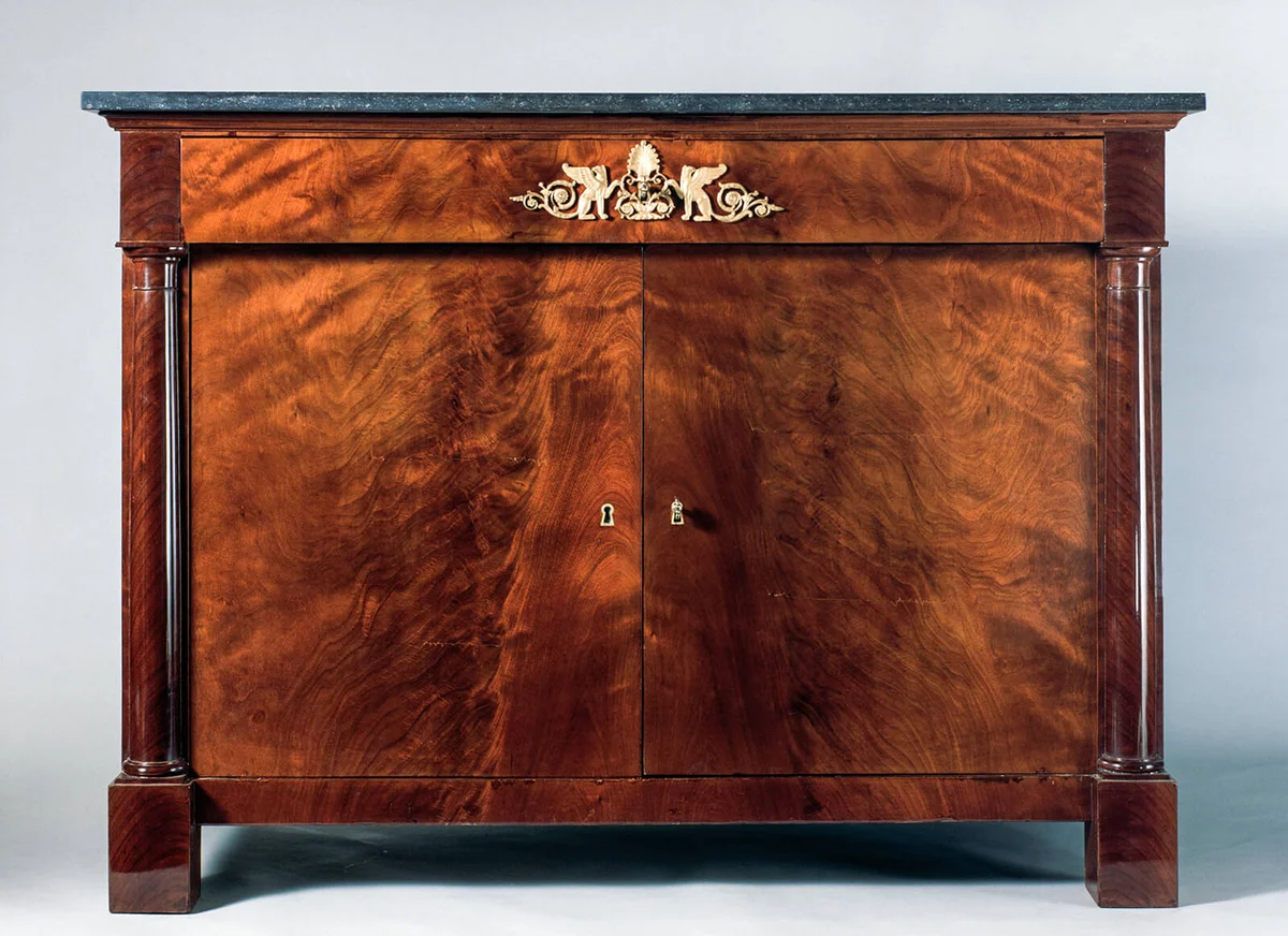 Empire-style mahogany veneered sideboard with gray marble top | Getty Editorial Use
