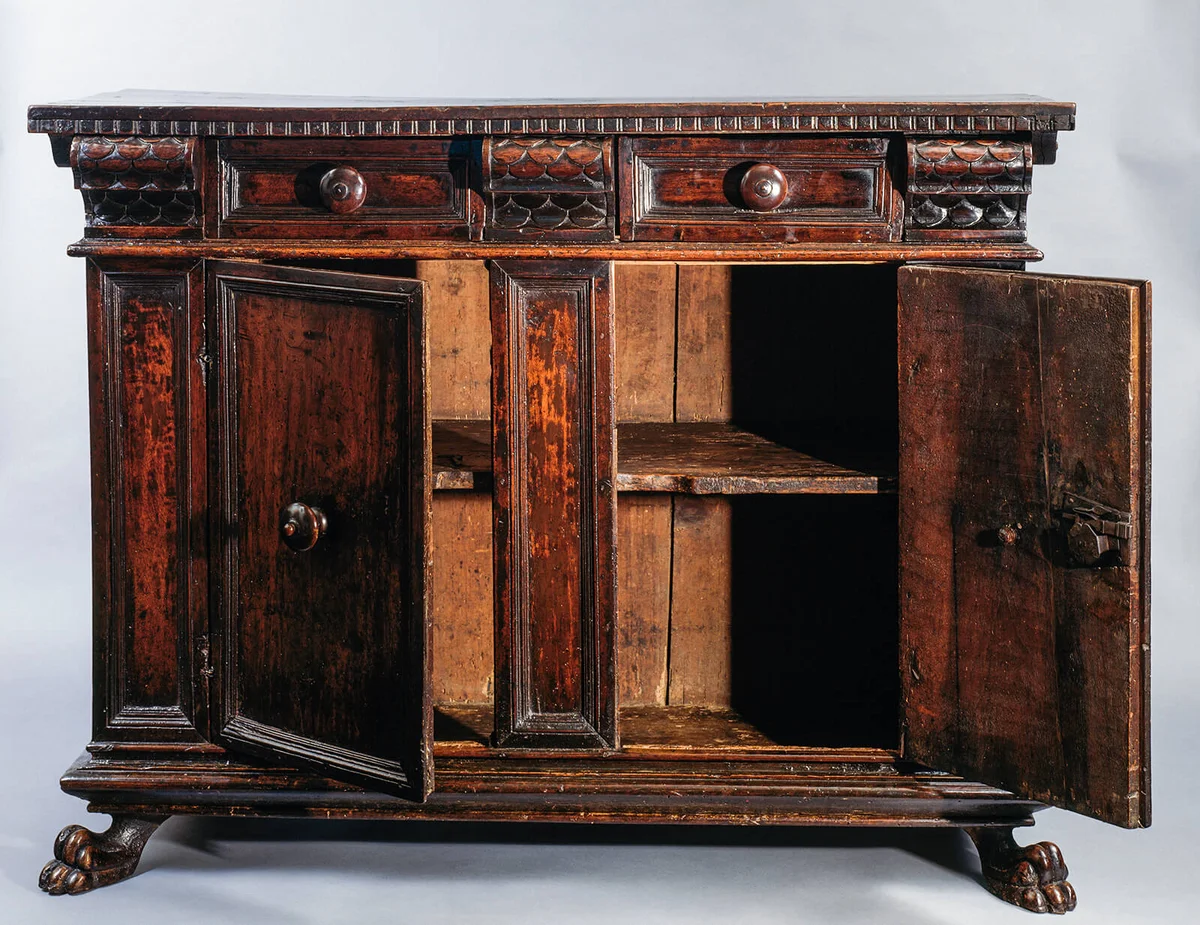 Emilian walnut sideboard, carved with two doors and two drawers, Renaissance style. Italy, 16th century | Getty Editorial Use