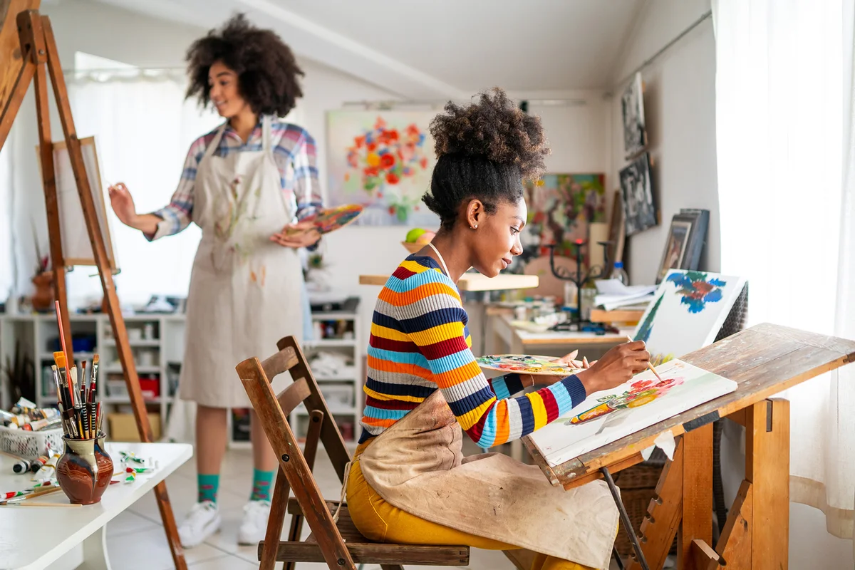 fine artists painting in studio