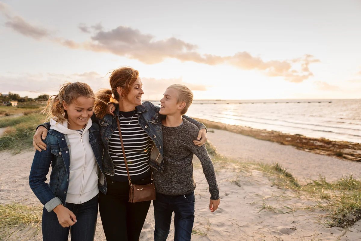 Mother and children at beach