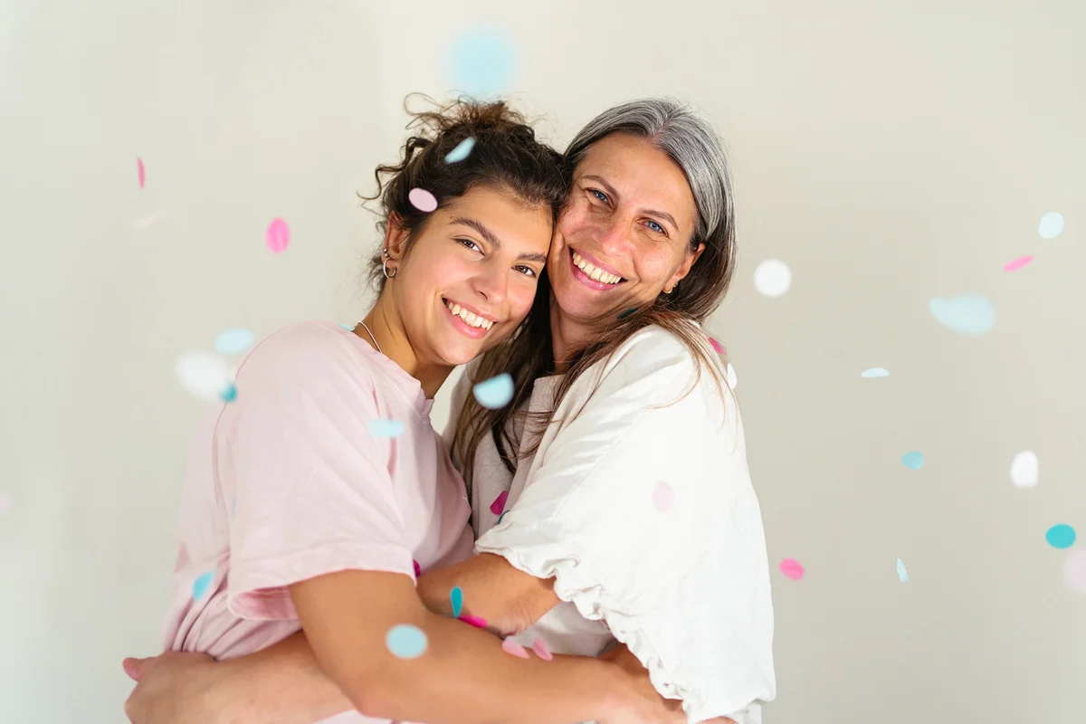 Mother and daughter with confetti