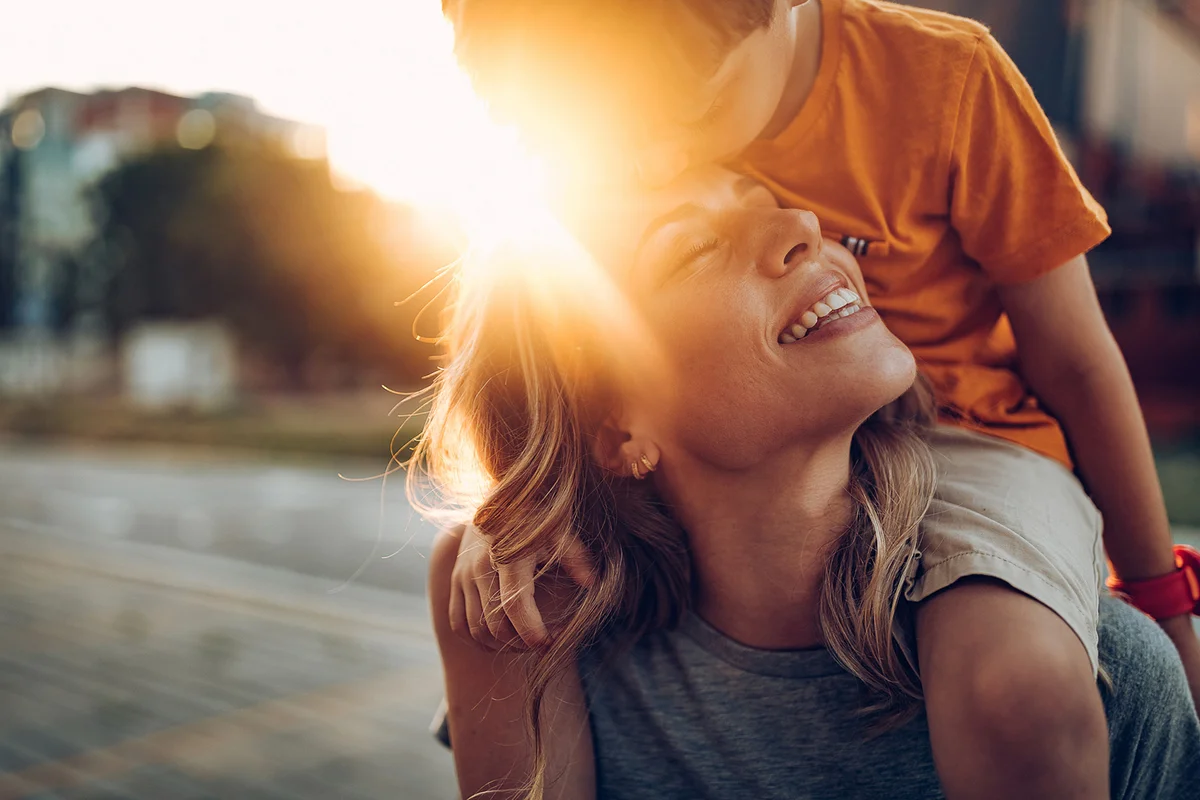 Mother and son playing outdoors