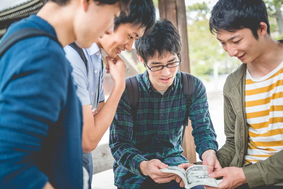 Male Students Reading Comic Book