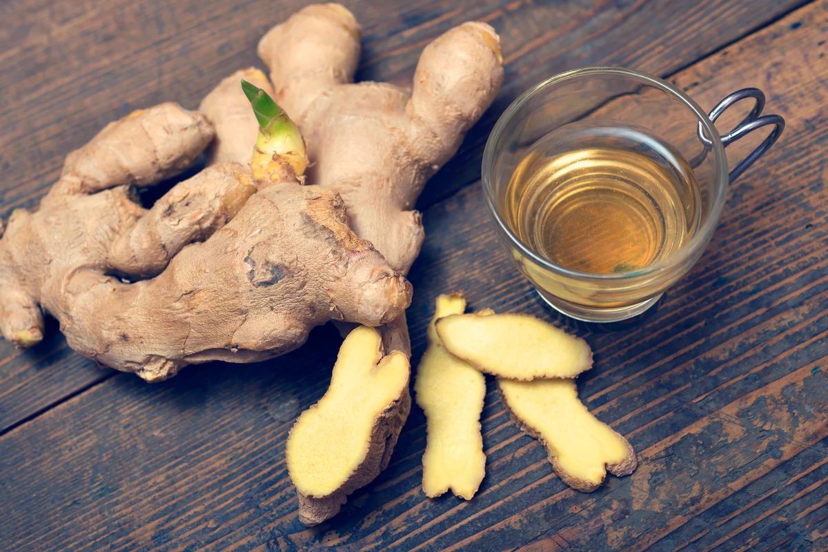 A cup of Ginger tea On rustic Table