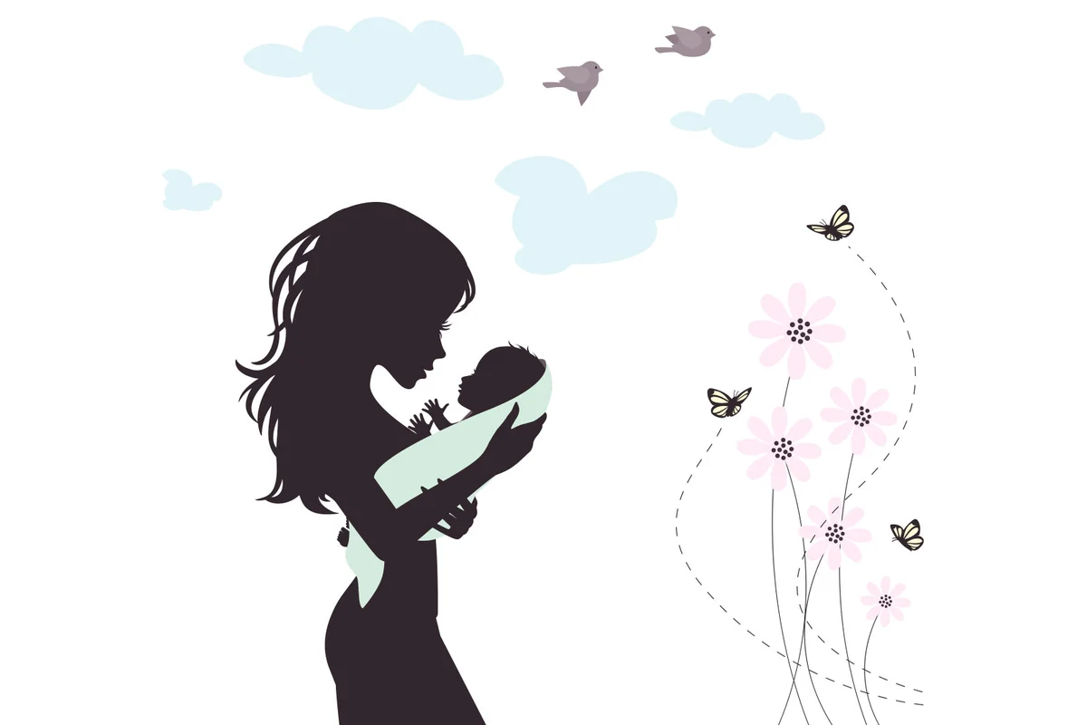mother holding baby in blanket