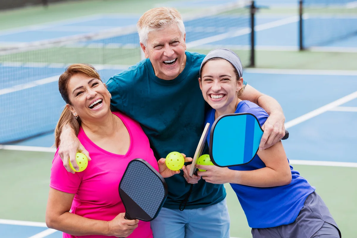 family playing pickle ball for mothers day