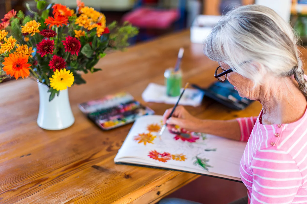 Senior woman painting