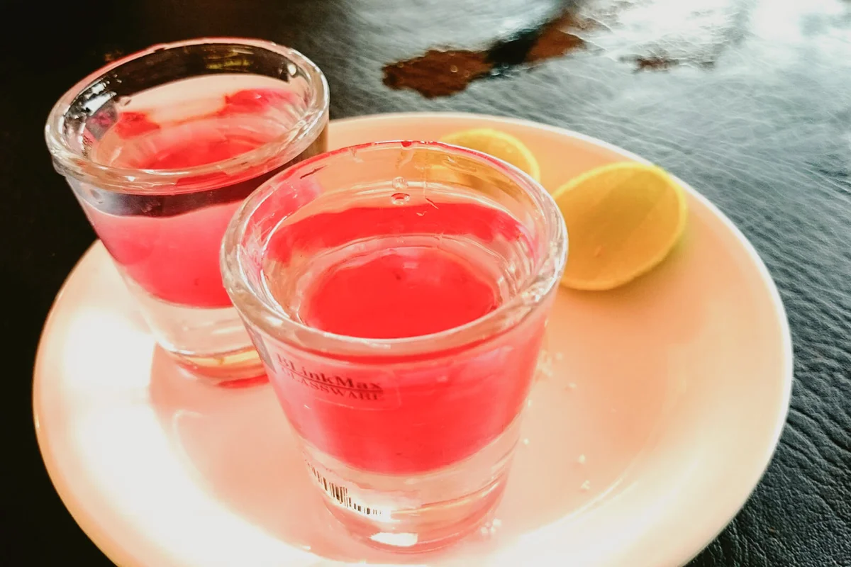 Shot Glasses With Lemon Slices On Table