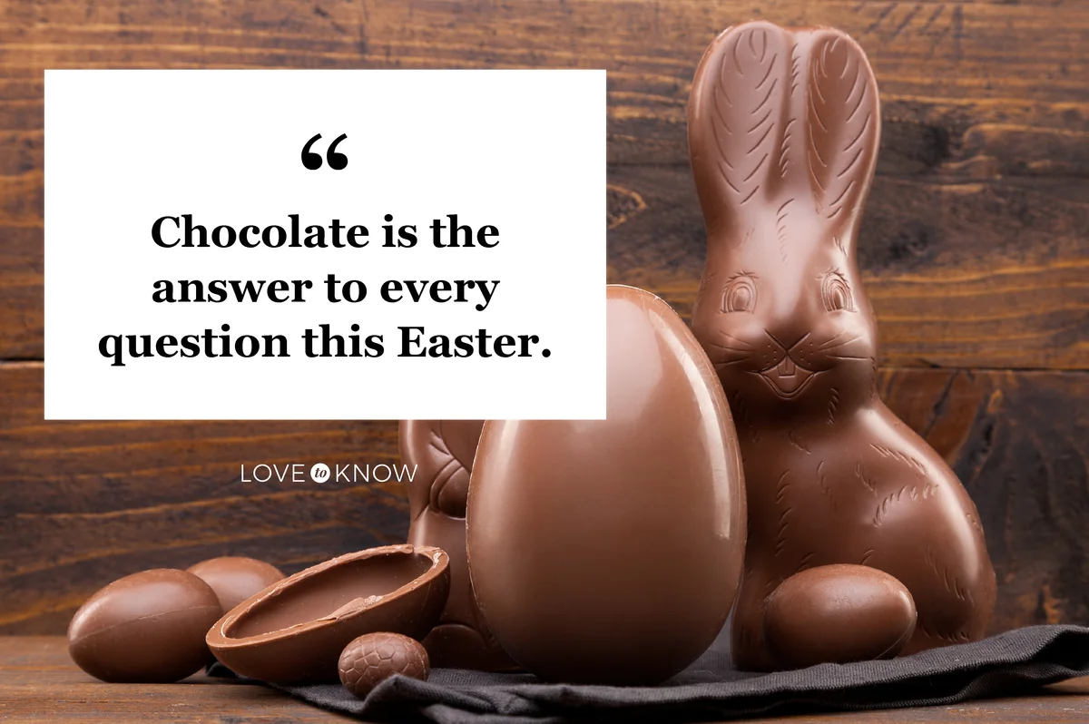 Chocolate Easter bunny, eggs and sweets on rustic background