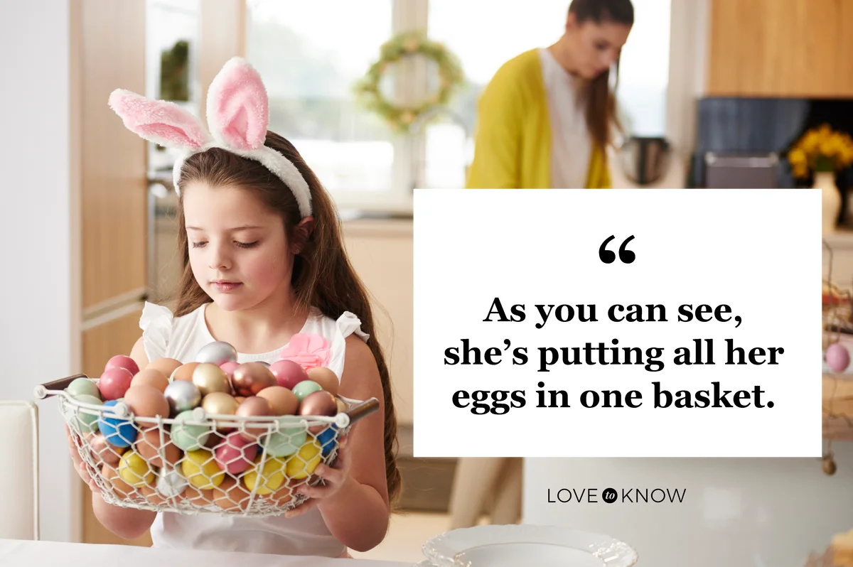 Girl placing basket full of Easter eggs on dining table