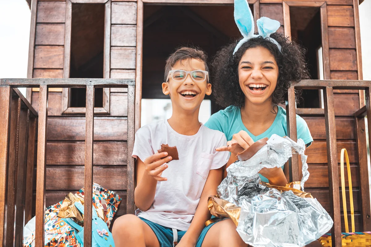 Children eating chocolate easter egg