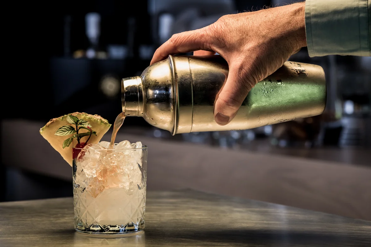 cobbler shaker pouring drink cocktail