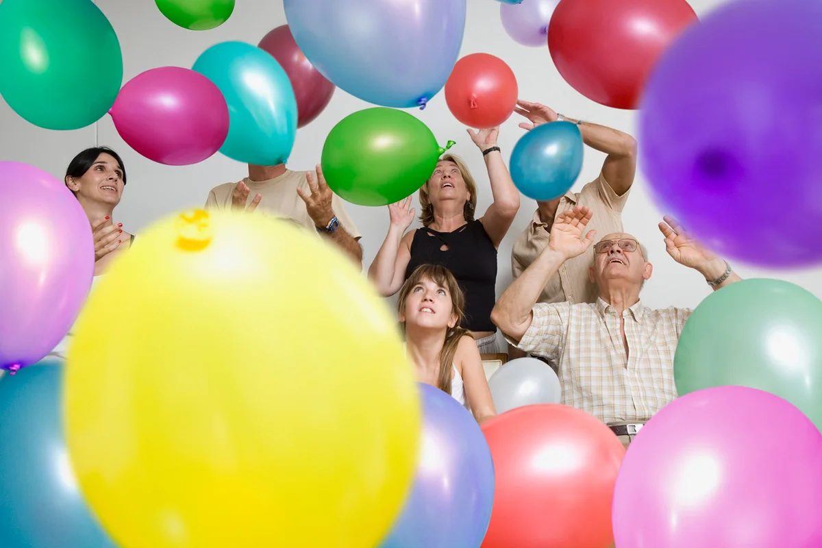 Family surrounded by balloons