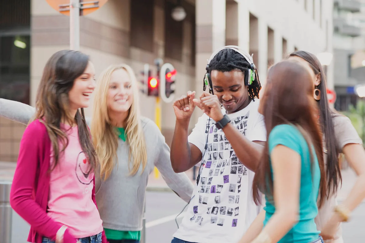 Friends dancing on the road