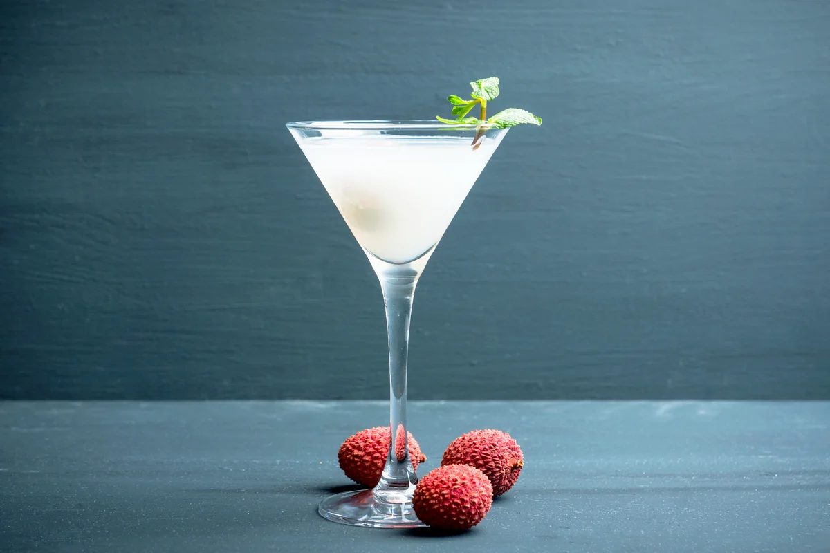 Sweet lychee martini on the rustic background