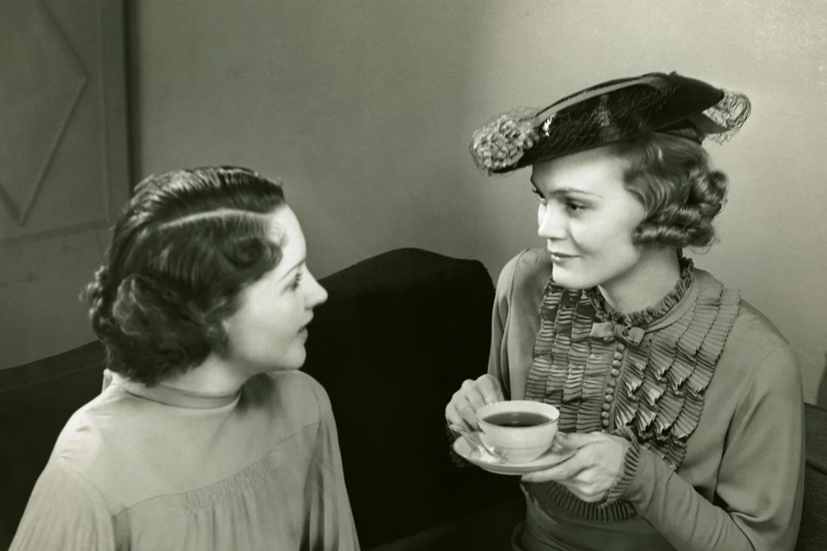 Two women socializing and drinking tea