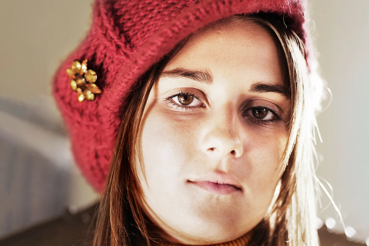 Young woman wearing knitted cap