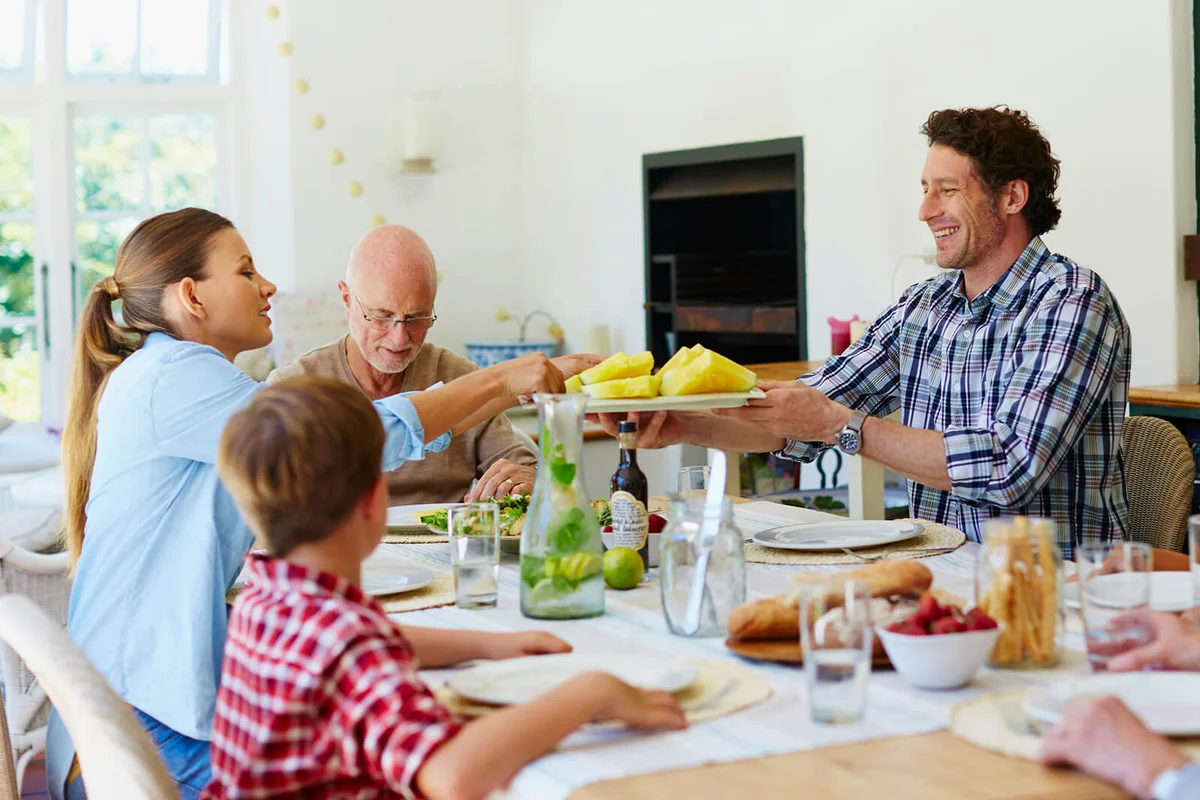 Family having meal at dining table