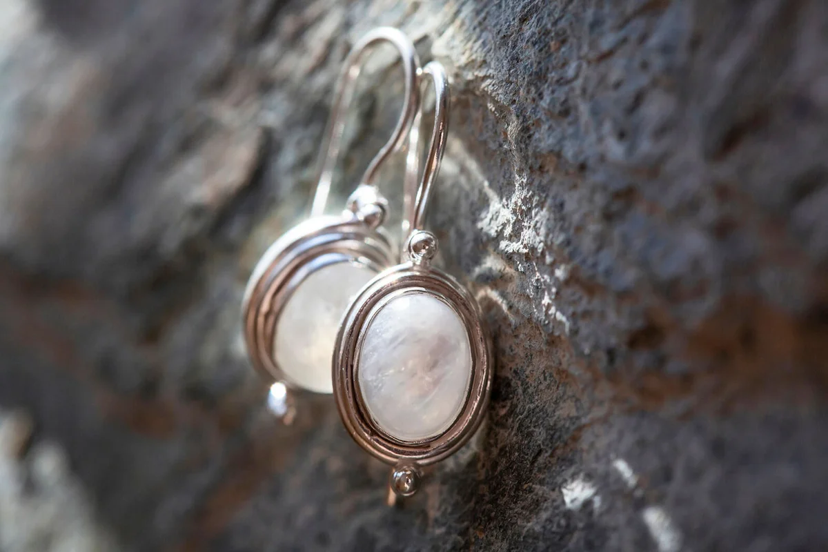 pair of sterling silver moon stone mineral earrings