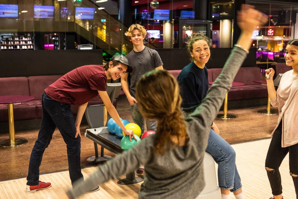 teenagers at bowling party