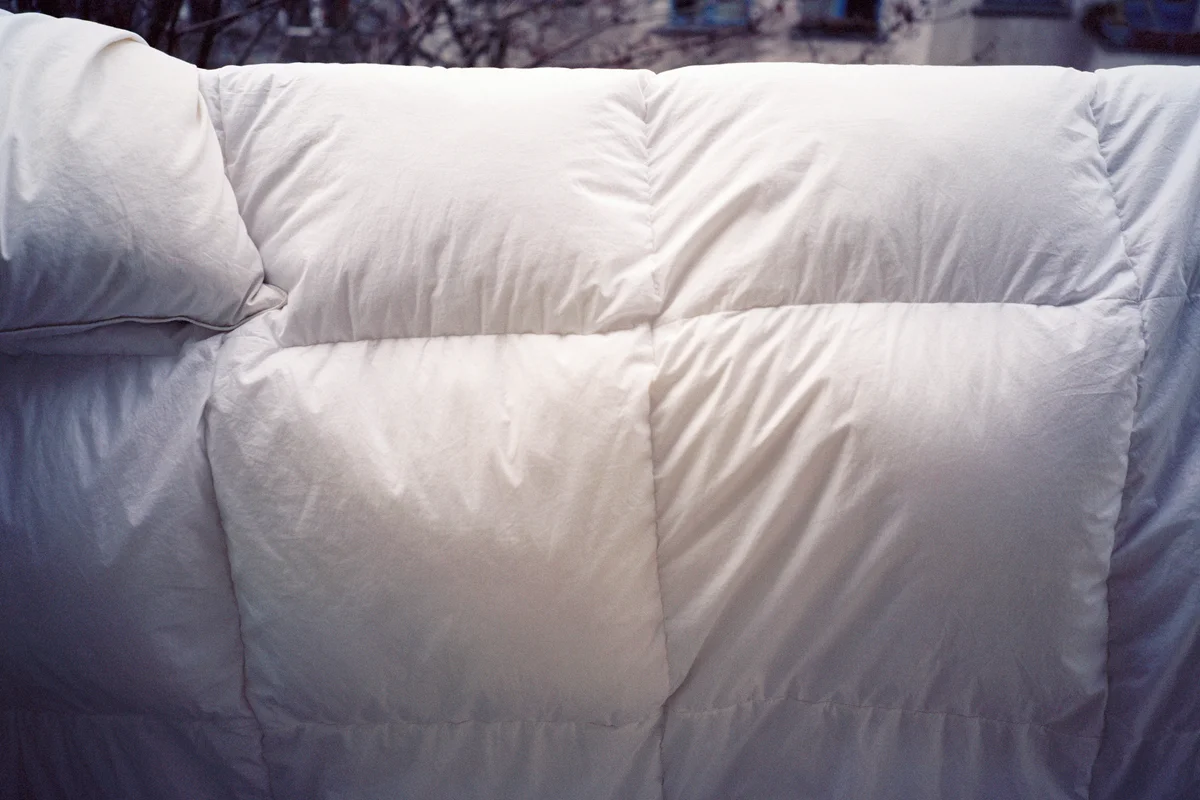A duvet hanging on a washing line