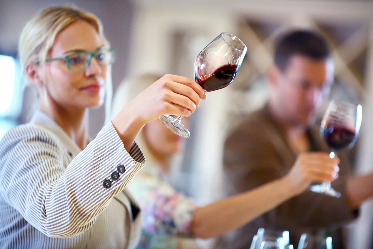 Oenologista tasting several types of wine