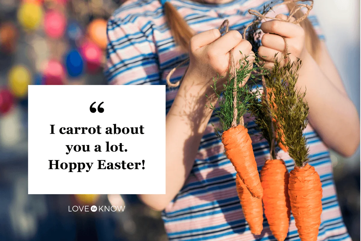 Midsection of child holding Easter carrot decorations