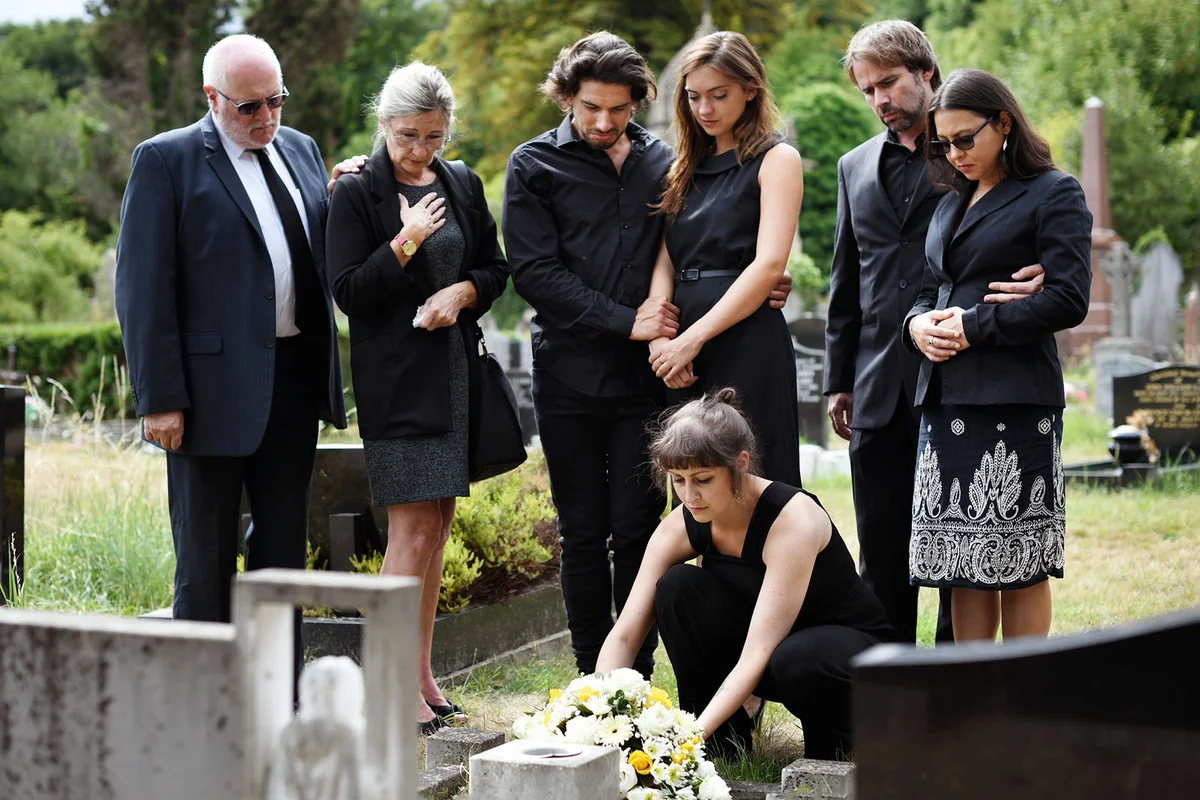 family grieving at funeral