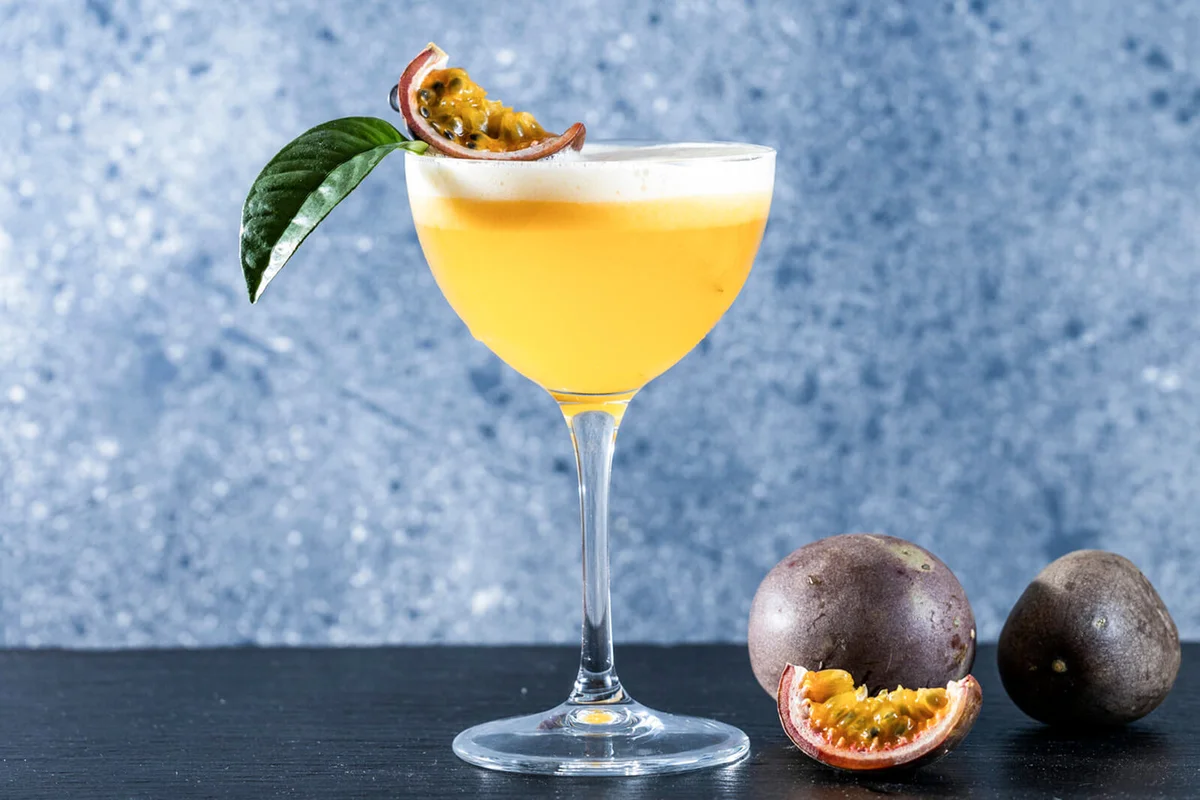 Glass of refreshing passionfruit Martini cocktail
