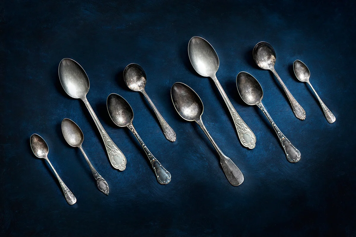 Vintage spoons on rustic background