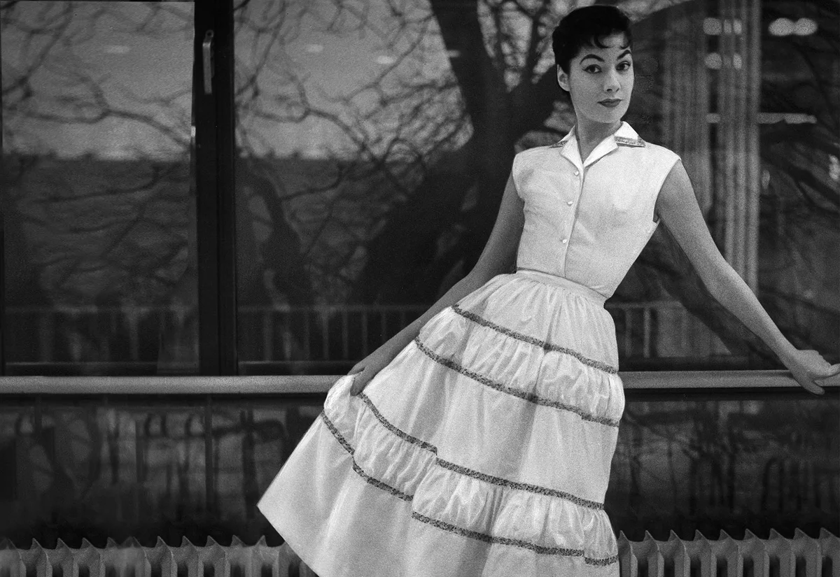 woman modeling dress 1950s fashion