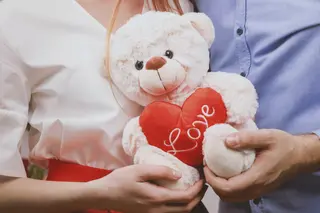 Couple holding Valentine bear