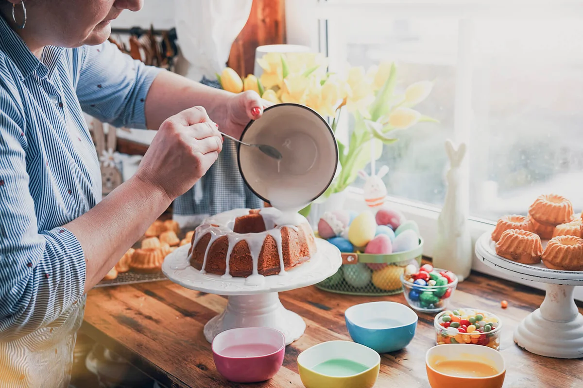 Preparing Small Easter Bunt Cakes with Icing