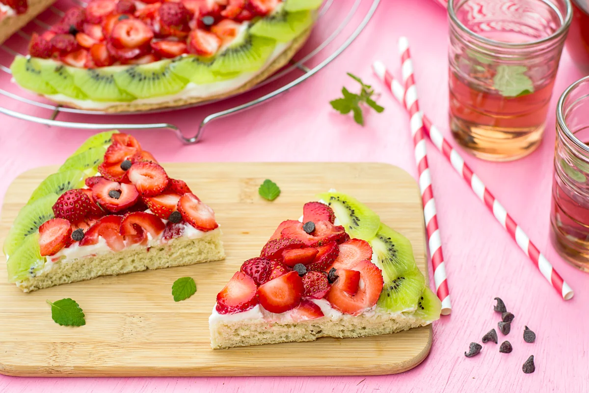 Sponge cake with strawberries and kiwi in shape of watermelon