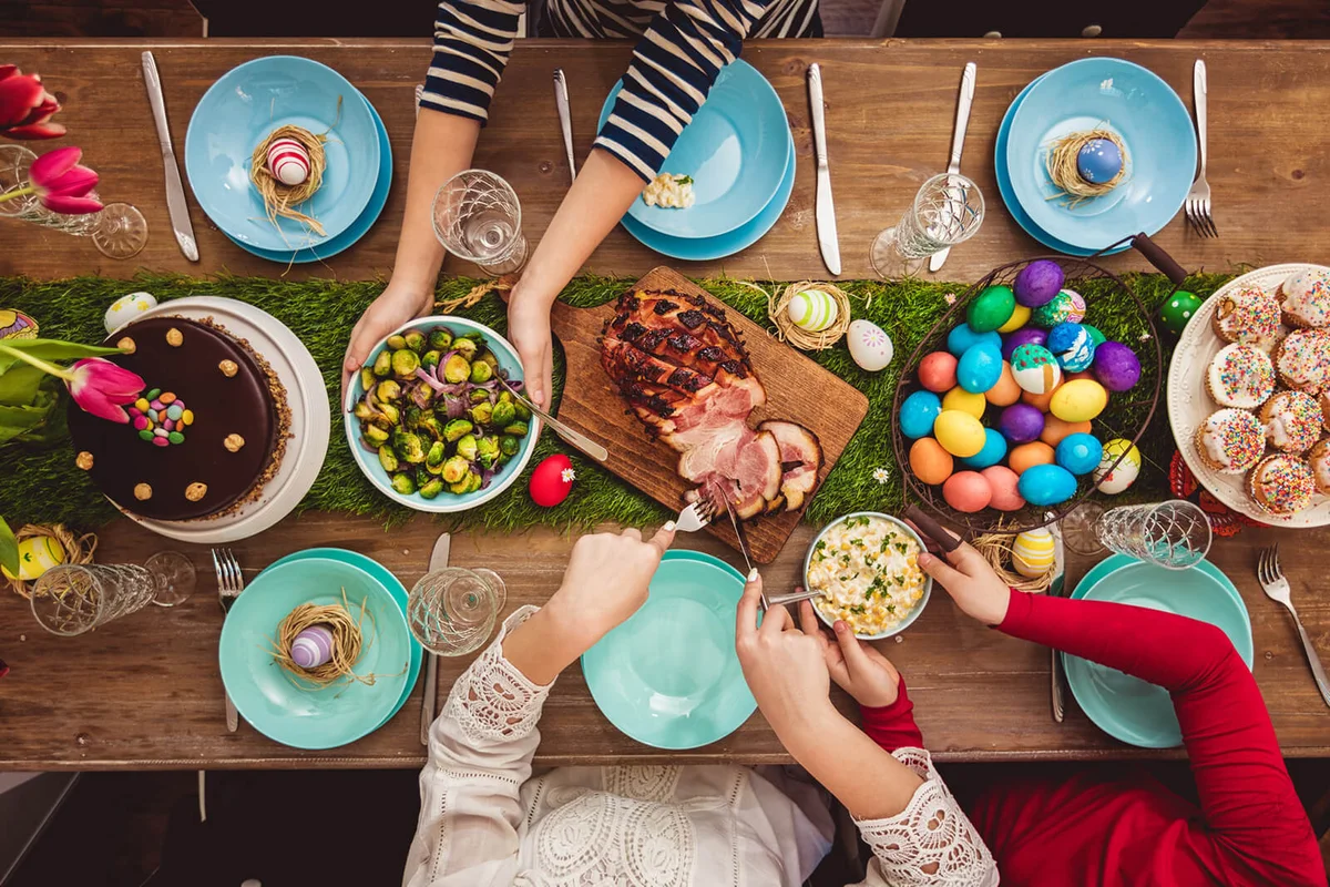Overhead view on decorated Easter table with family around