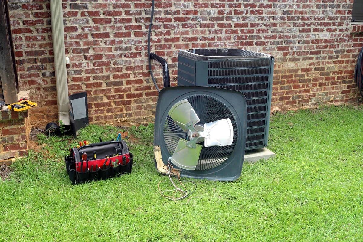 Air Conditioner compressor condenser coil with fan and tools for maintenance