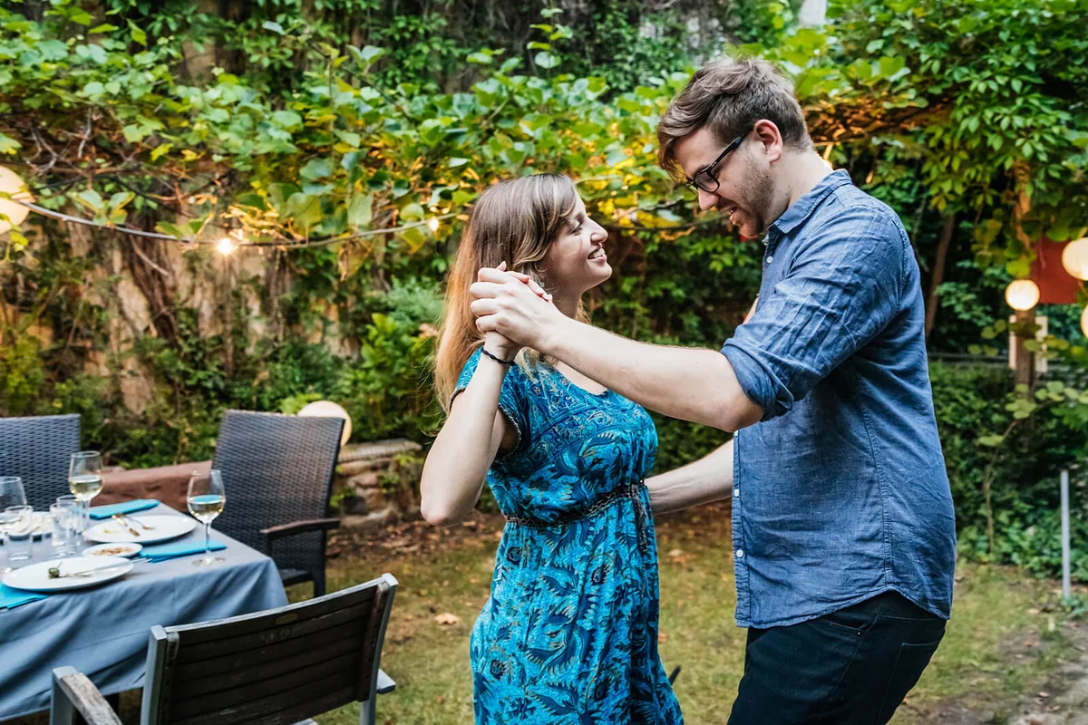 Couple Dancing At Family BBQ