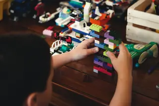 Child playing with LEGO