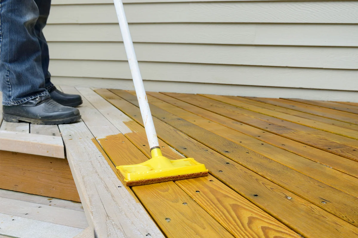 applying stain to wood deck
