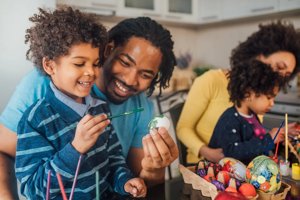 family decorating eggs