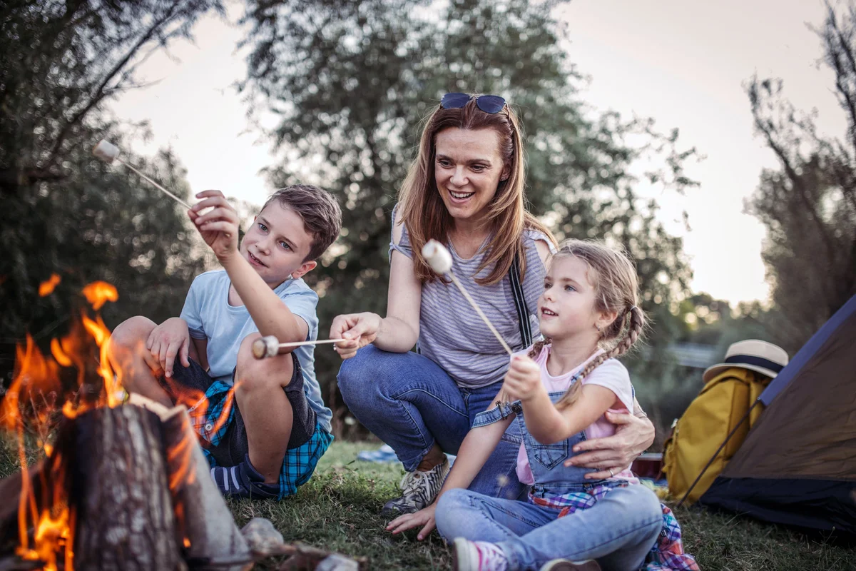 family bonfire roasting marshmallows