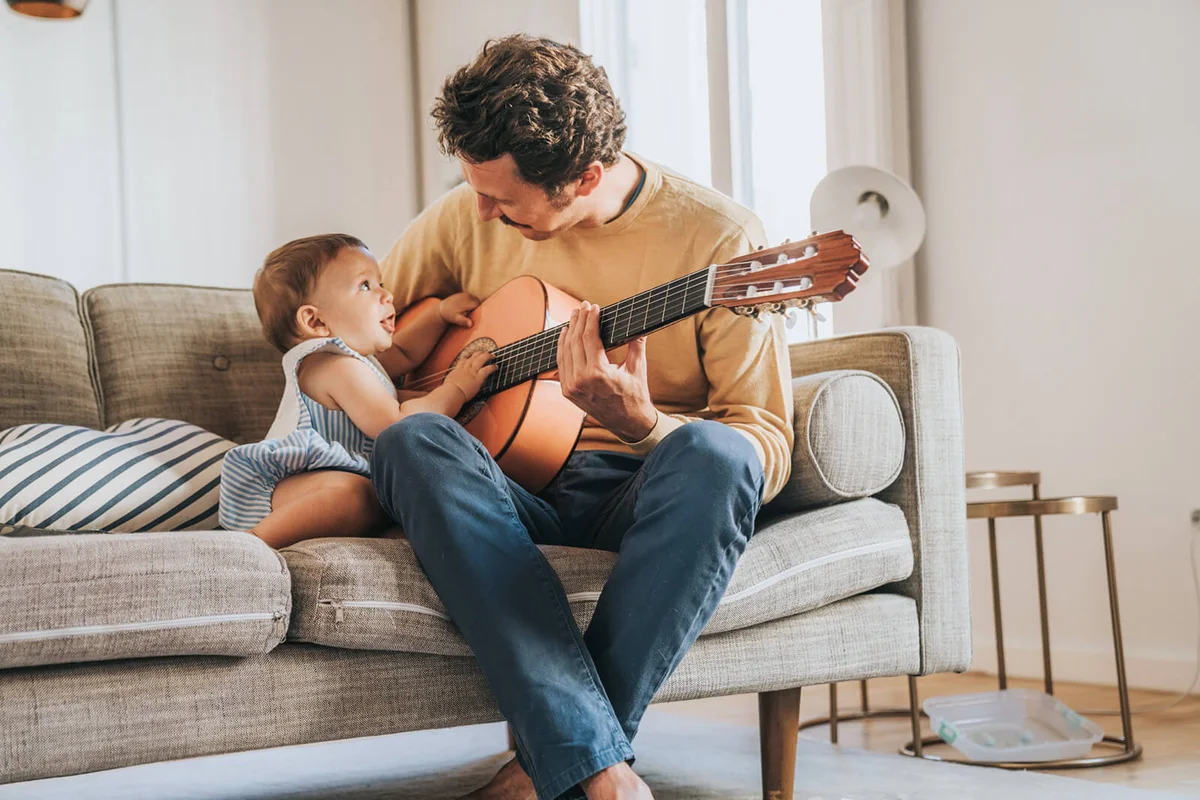 Father Playing Guitar for Baby