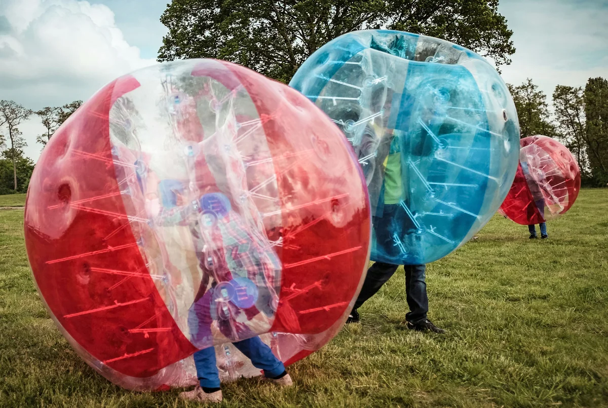 play bubble soccer game in yard
