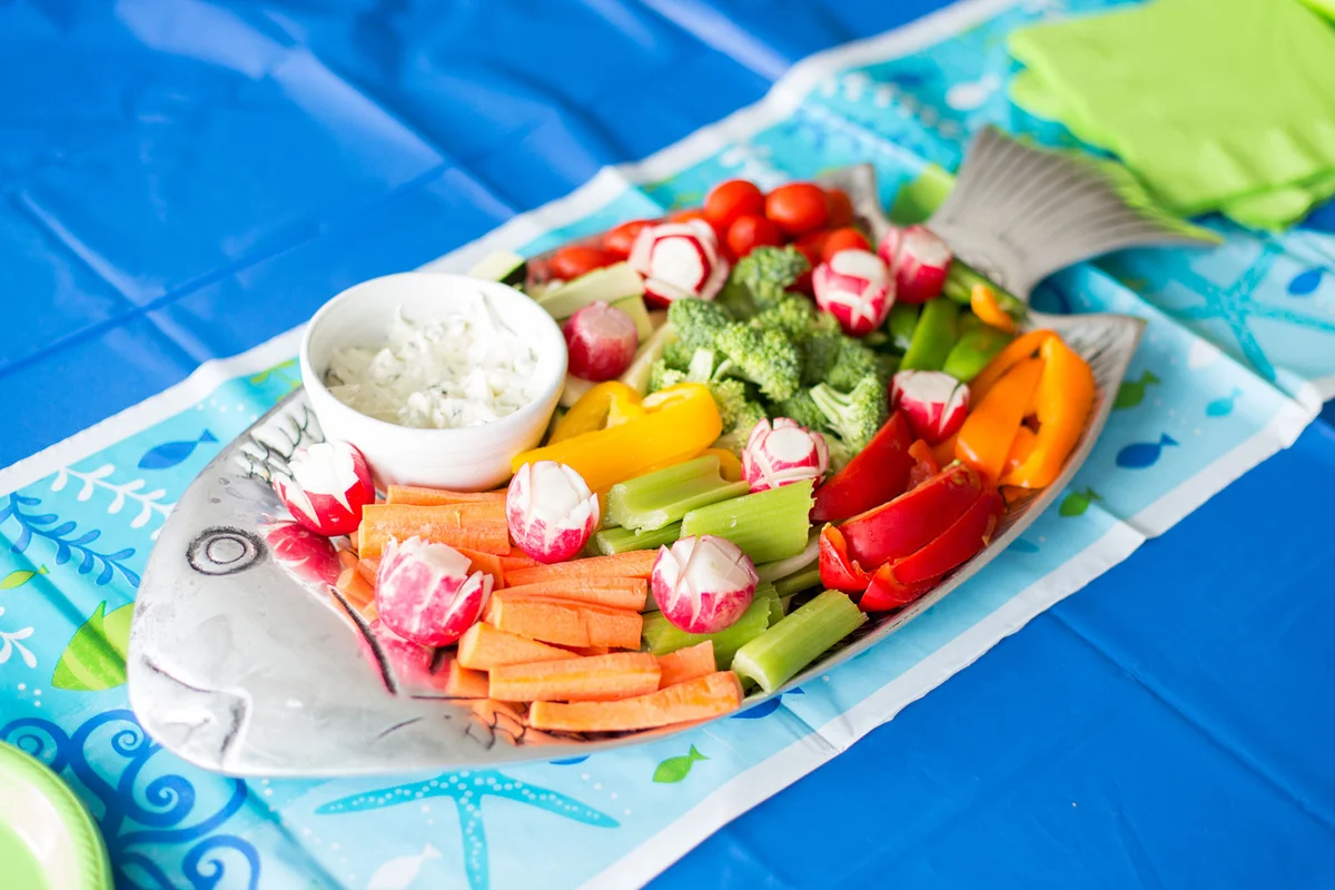 decorative fish shaped plate with fresh vegetables