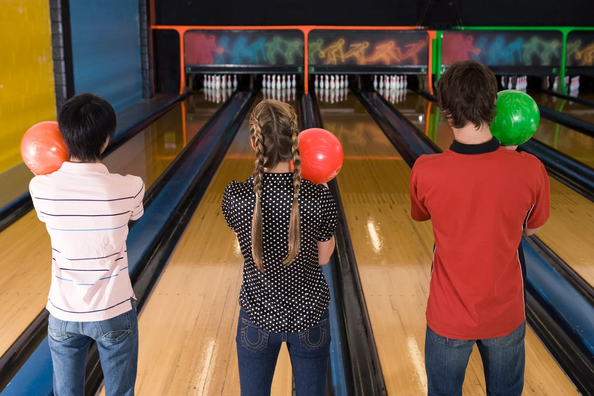 Teenagers bowling