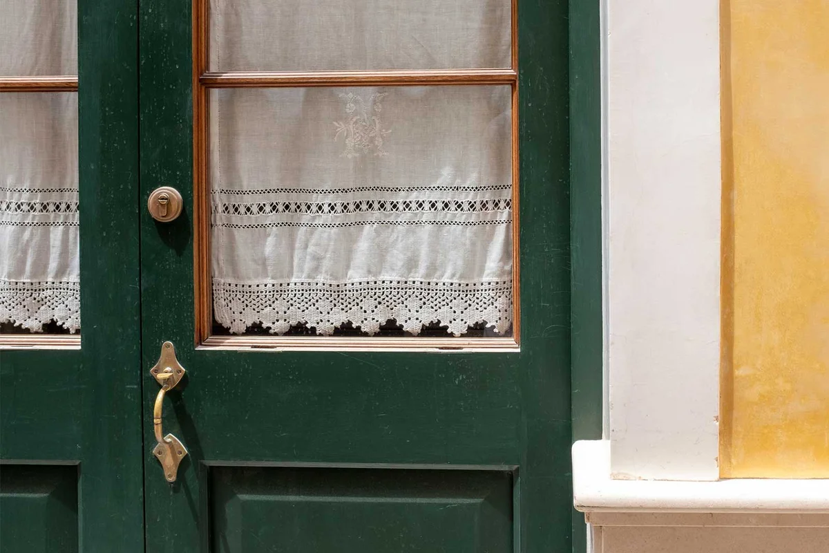 antique vintage curtains at front door