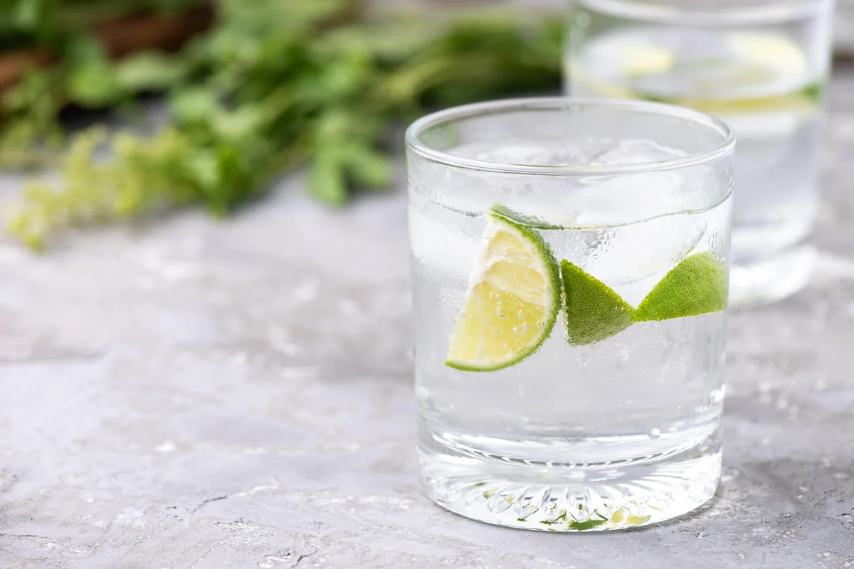 Green lemon soda on wood