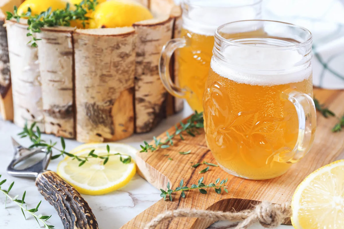 Two Beer Mug Of Light Lemon Sour Beer And Citrus