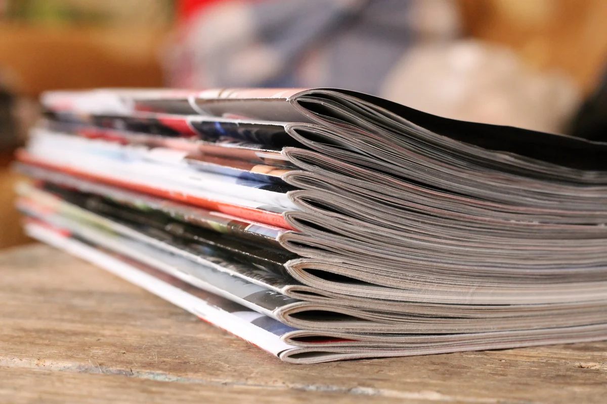 stack of vintage comic books on table